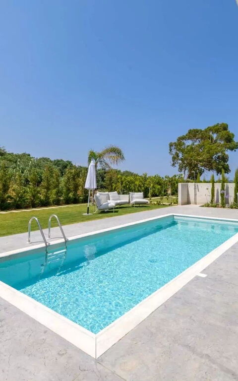 By the Beach - Blue Topaz Villa: Building Exterior, Garden, Outdoor, Pool